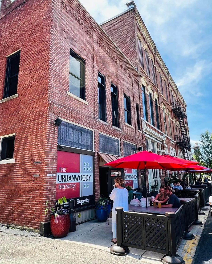 The red brick exterior of The UrbanWoody Brewery building