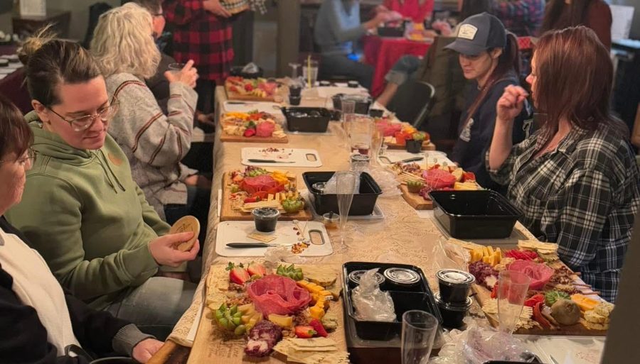 A group gathered around a long table for dinner